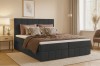 Elegantes Boxspringbett in Anthrazit mit stilvoller Dekoration im Schlafzimmer.