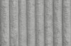 Detailansicht der weichen Cord-Stoff-Struktur des Boxspringbettes in Beige.