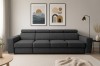 Modernes dunkelgraues XXL-Sofa im hellen Wohnzimmer mit Wandbildern.