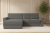 Dunkelgraues Ecksofa in elegantem Wohnzimmer mit Pflanze und Teppich.