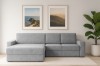 Hellgraues Ecksofa in modernem Wohnzimmer mit Wandbildern und Pflanze.