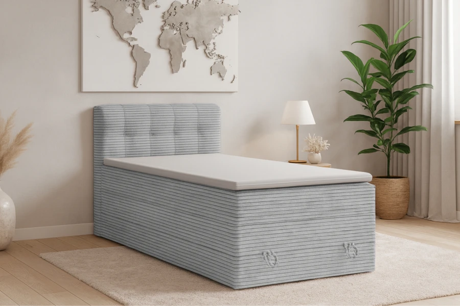 Graues Boxspringbett im Jugendzimmer mit moderner Einrichtung und Weltkarte