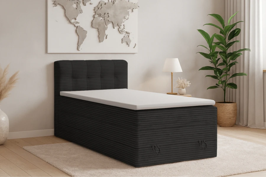 Anthrazitfarbenes Boxspringbett JUNG II mit Cord-Bezug für das Jugendzimmer.