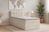 Beiges Boxspringbett in Cord-Optik im modern eingerichteten Schlafzimmer.