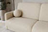 Nahaufnahme eines cremefarbenen Bouclé-Sofas mit rundem Dekokissen.
