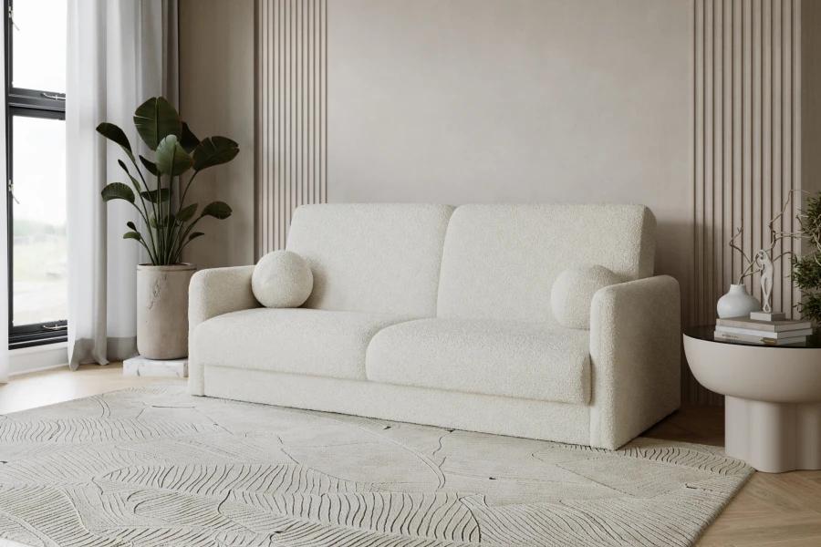 Modernes beiges Sofa aus Bouclé-Stoff in einem hellen, minimalistischen Wohnzimmer.