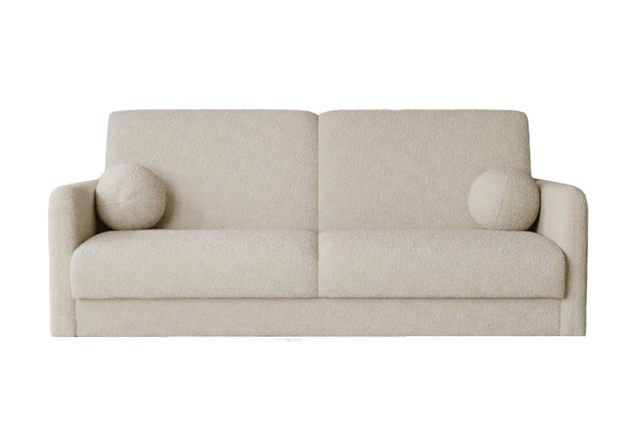 Cremefarbenes Bouclé-Schlafsofa mit runden Kissen vor weißem Hintergrund