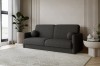 Elegantes anthrazitfarbenes Bouclé-Sofa mit runden Kissen in minimalistischem Wohnambiente.