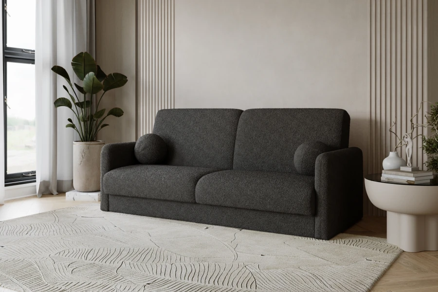 Elegantes anthrazitfarbenes Bouclé-Sofa mit runden Kissen in minimalistischem Wohnambiente.