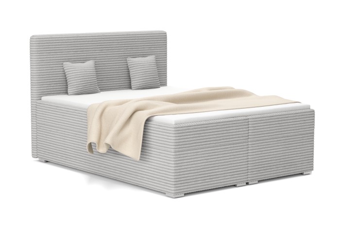 Modernes graues Boxspringbett mit stilvollem Cordbezug, passenden Kissen und gemütlicher Tagesdecke.