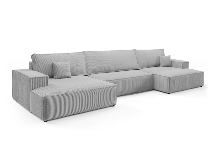 Graue U-Form Wohnlandschaft aus modernem Cordstoff vor weißem Hintergrund.