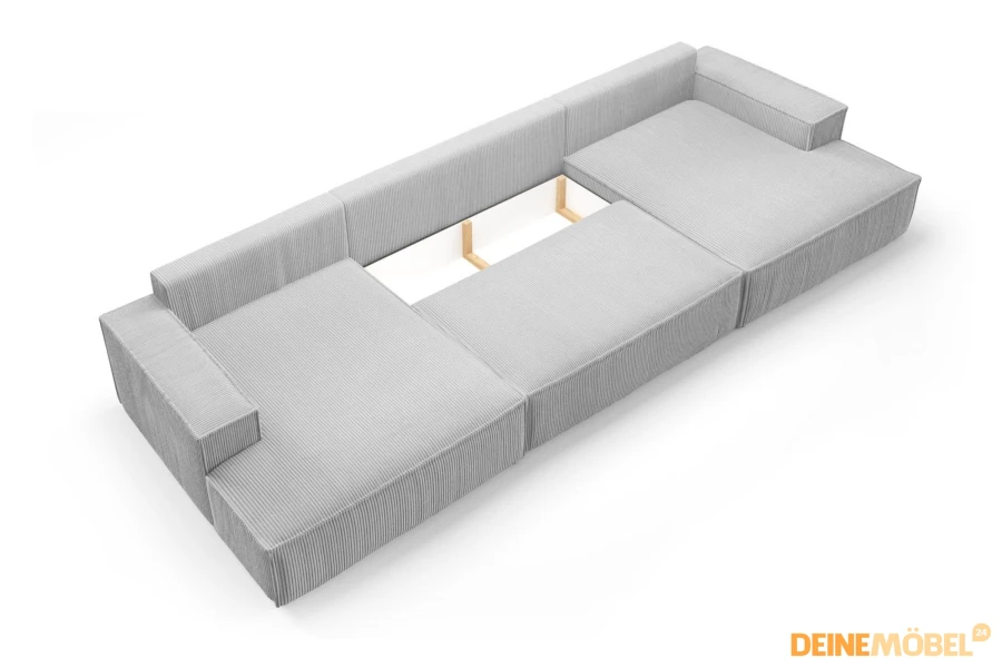 Integriertes Staufach im Bettkasten des hellgrauen Cord-Sofas für Bettzeug.