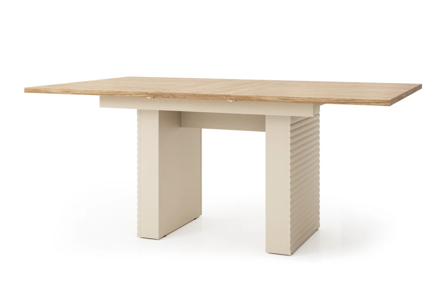 Ausziehbarer Esstisch mit geriffelten Standbeinen in Beige und Eichenoptik.