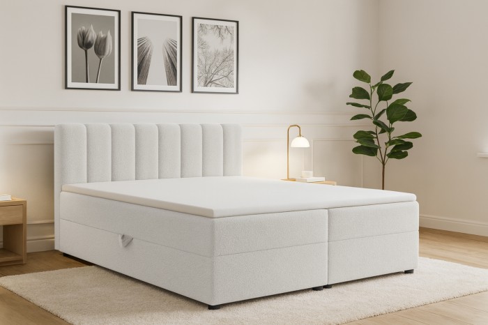 Modernes weißes Boxspringbett Vanessa mit vertikal gestepptem Kopfteil in hellem Schlafzimmer.
