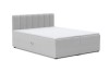 Hellgraues Boxspringbett aus Bouclé-Stoff mit modernem, gestepptem Kopfteil auf weißem Hintergrund.