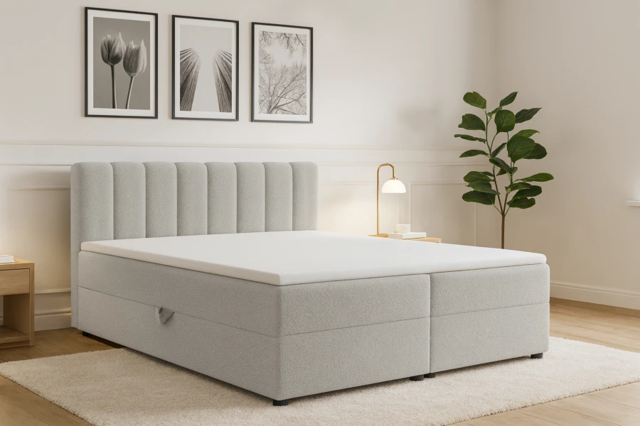 Stijlvolle slaapkamer met lichtgrijs boxspringbed, kamerplant en minimalistische muurkunst.