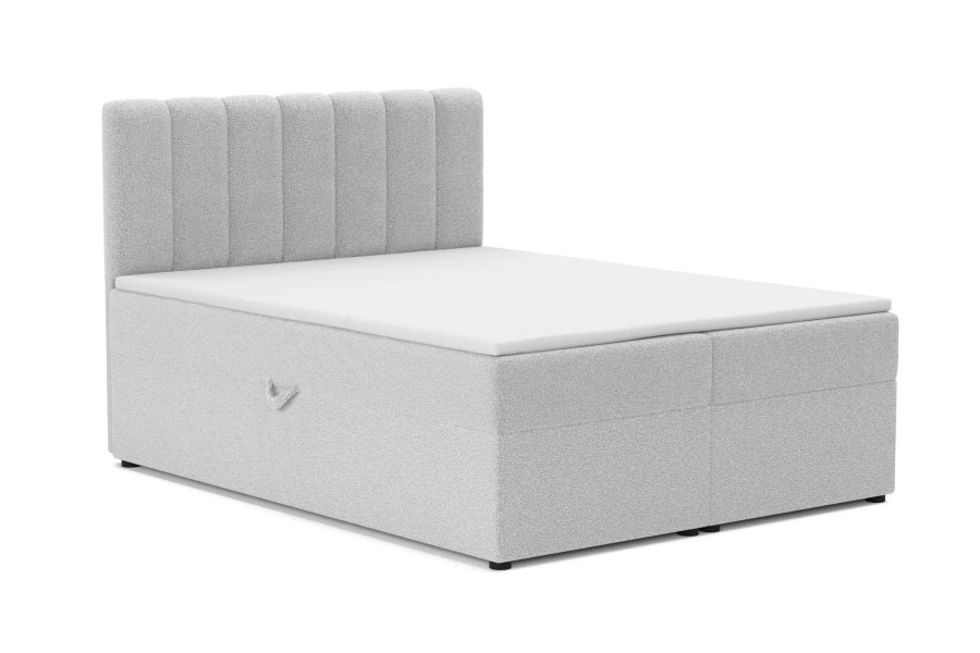 Modernes Boxspringbett in Hellgrau mit gestepptem Kopfteil und weißer Liegefläche.
