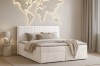 Stilvolles Schlafzimmer mit beige Cord-Boxspringbett und dekorativer Weltkarte als Wandleuchte.