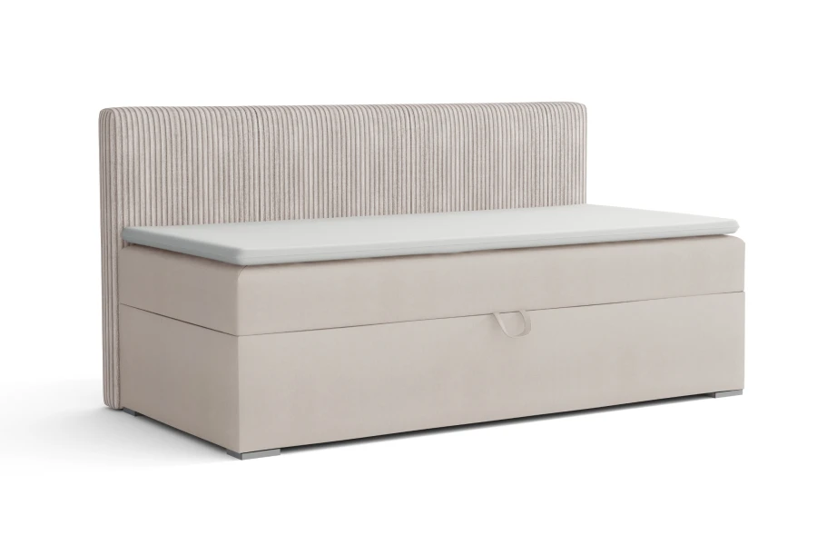 Upholstered bed in ecru with vertical corduroy look on the headboard and storage space.