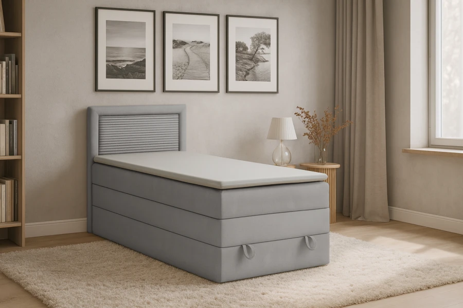 Graues Boxspringbett in modern eingerichtetem Schlafzimmer.