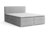 Modernes hellgraues Boxspringbett mit gepolstertem Kopfteil und weißer Matratze.