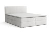 Weißes Boxspringbett mit gepolstertem Kopfteil freigestellt auf Weiß.