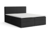 Elegantes schwarzes Boxspringbett mit weißer Matratzenauflage.
