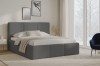 Elegantes Schlafzimmer mit anthrazitfarbenem Polsterbett und Blick in den Winter.