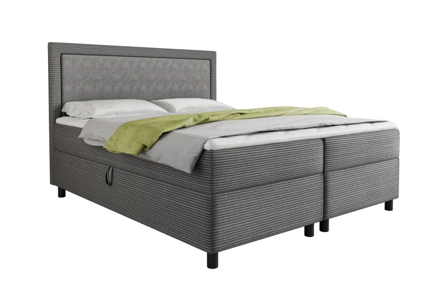Elegantes Boxspringbett in dunklem Grau mit grünem Akzent und Bettkasten-Funktion.