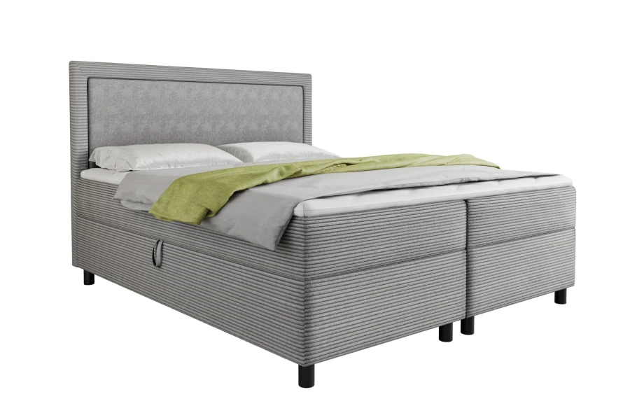 Modernes graues Boxspringbett mit Cord-Bezug Poso auf weißem Hintergrund.