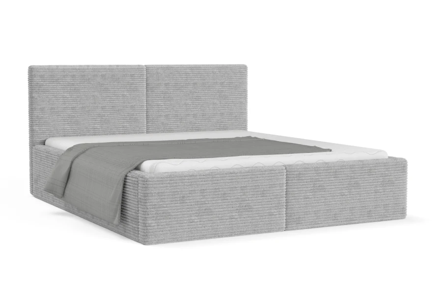 Hellgraues Boxspringbett mit Cord-Bezug, freigestellt auf weißem Hintergrund.
