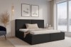 Modernes schwarzes Polsterbett in Cord-Optik in gemütlichem Schlafzimmer-Ambiente.