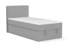 Modernes Boxspringbett in Hellgrau mit geriffeltem Kopfteil für Einzelzimmer.