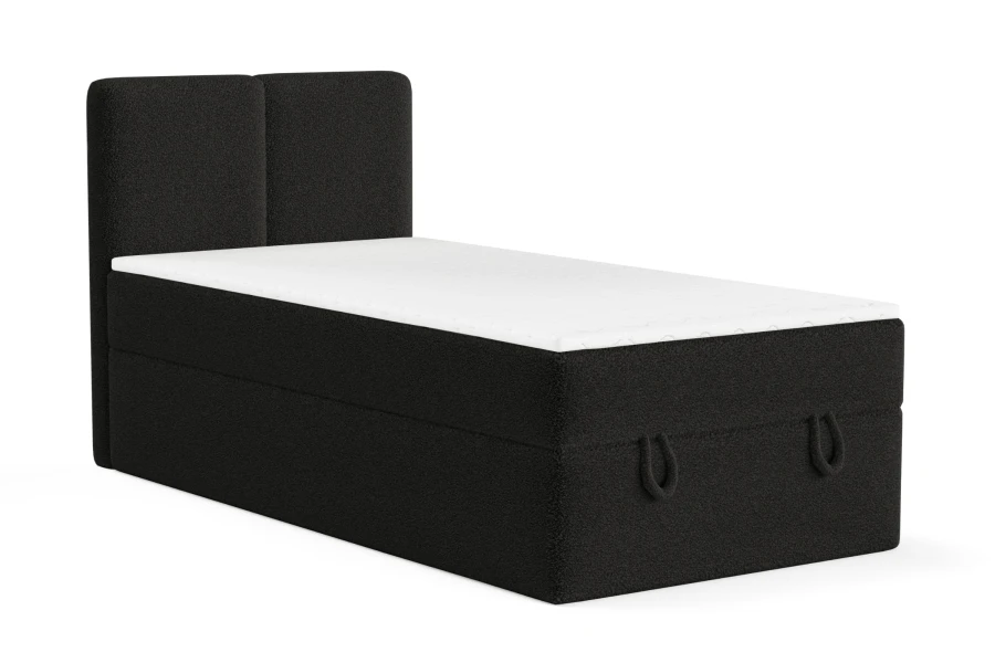 Modernes Boxspring-Einzelbett in Schwarz mit Bouclé-Bezug.