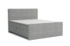 Graues Boxspringbett aus Cord mit hohem Kopfteil vor weißem Hintergrund.
