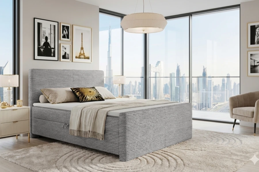 Luxueuze slaapkamer met grijs corduroy boxspringbed en indrukwekkend uitzicht op de stad.