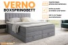 Graues Verno Boxspringbett mit zwei Bettkästen und 4 cm Kaltschaum-Topper im modernen Schlafzimmer.
