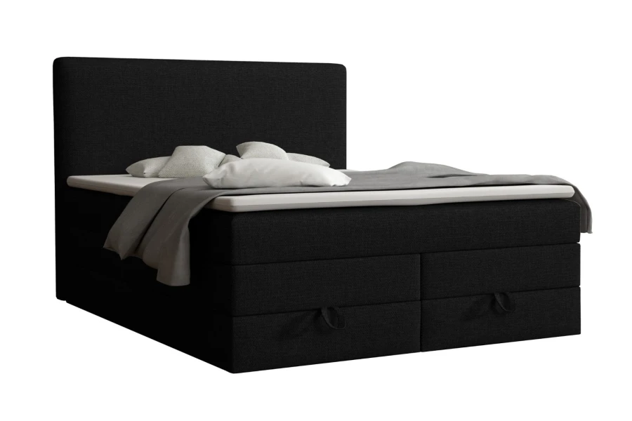 Modernes schwarzes Boxspringbett mit Bettkasten und weißem Topper auf weißem Hintergrund.
