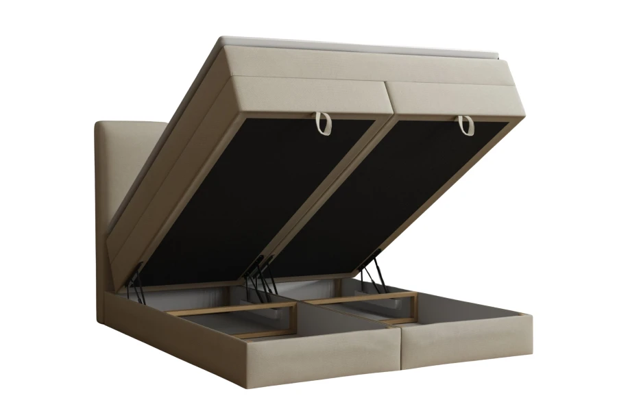 Beiges Boxspringbett mit zwei geöffneten Bettkästen für praktischen Stauraum unter der Liegefläche.