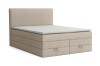 Elegantes Boxspringbett in Beige mit gepolstertem Kopfteil und seitlichen Griffschlaufen.