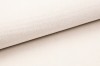 Nahaufnahme der hochwertigen, beigen Stofftextur eines modernen Boxspringbettes.