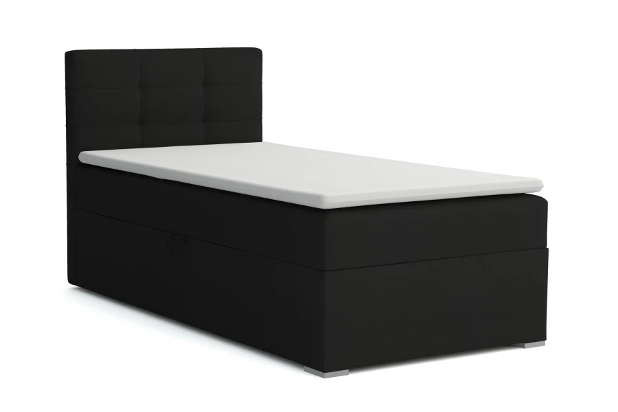 Schwarzes Boxspringbett mit gepolstertem Kopfteil und weißem Topper auf weißem Hintergrund.