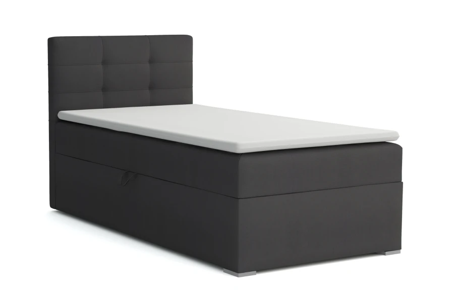 Anthrazitfarbenes Boxspringbett für Singles vor weißem Hintergrund.