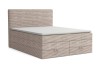 Modernes Boxspringbett in beigem Cord-Design mit praktischen Schubladen am Fußende.