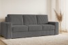 Dunkelgraues Cordsofa im gemütlichen Wohnzimmer-Ambiente mit hellem Teppich.
