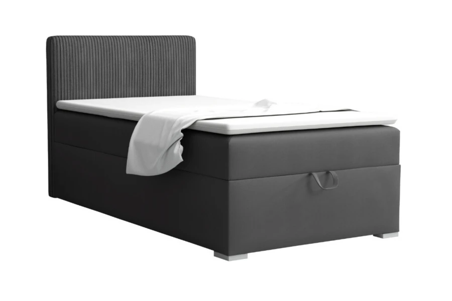 Elegantes Boxspringbett in Anthrazit mit markantem geriffeltem Kopfteil.