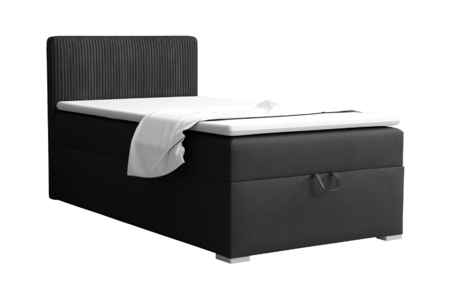 Schwarzes Boxspringbett mit geriffeltem Kopfteil und praktischem Bettkasten-Auszug.