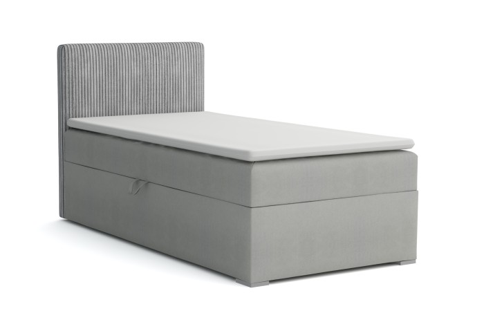 Graues Boxspringbett mit markantem Cord-Kopfteil und Bettkasten auf weißem Hintergrund.