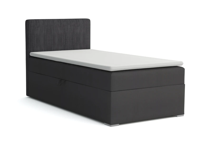 Einzel-Boxspringbett in Anthrazit mit vertikal gestepptem Kopfteil.