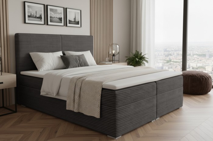 Anthrazitfarbenes Boxspringbett mit hohem Kopfteil in hellem, modernem Schlafzimmer.